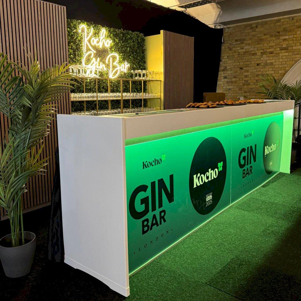 Our brand new white modular bar with living wall back bar and a mix of our new walnut slatted panels.